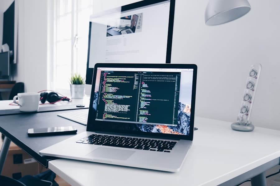 Developer's laptop showing code on a clean desk